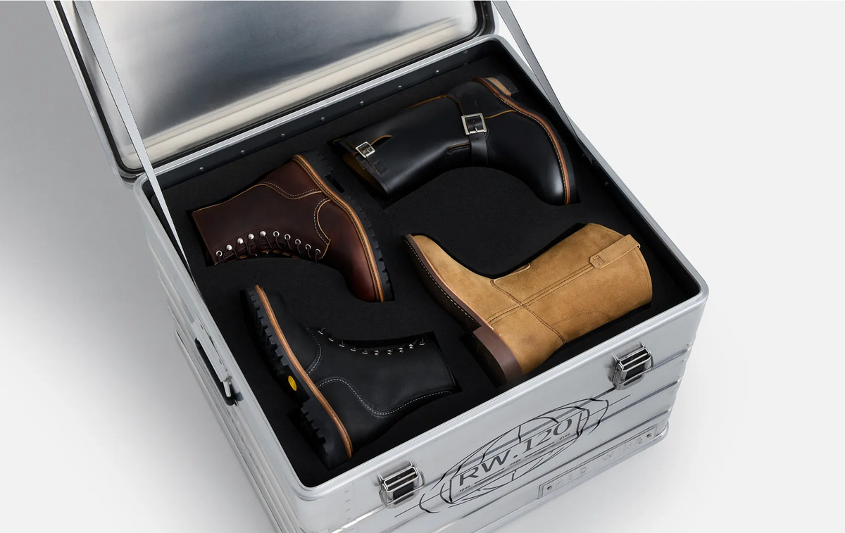 Four Red Wing Heritage boots inside the open RW.120 metal capsule